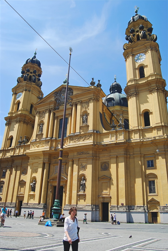 The bright yellow facade of the Theatine Church (Theatinerkirche) located at Odeonsplatz in Munich